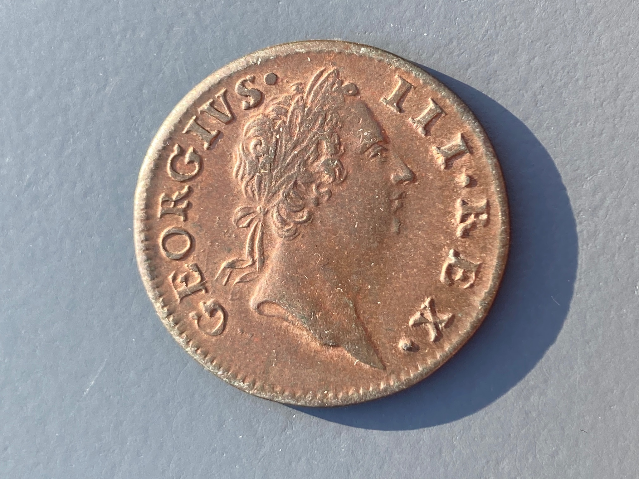 Ireland coins, a George III Halfpenny, 1769, Type II laureate bust with taller head, rev. crowned harp (DF 582; S.6613), tiny edge fault to rev. at 8 o’clock otherwise good VF or better, traces of lustre